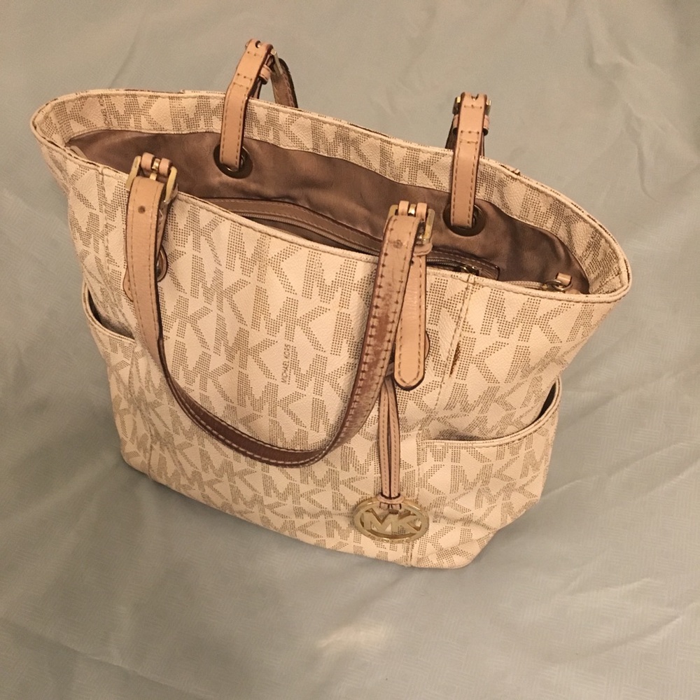 MK lovingly used and well loved bag. Cream/tan.